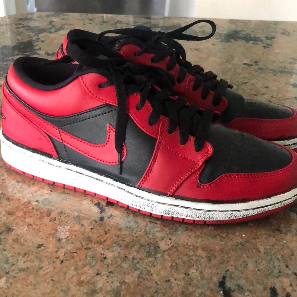 Men’s red and black Jordan low size 9.5